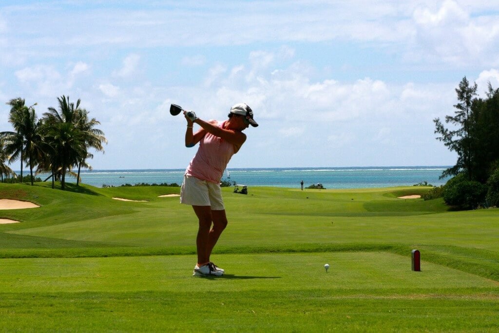 Girl-golf-player-with-driver-teeingoff-from-teebox-to-shoot-051114B6327B617C-1024x683